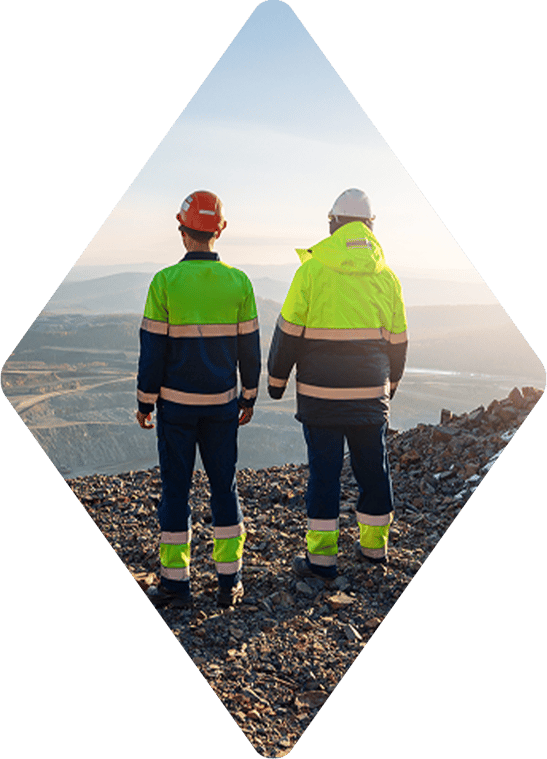 two engineers looking over a ridge